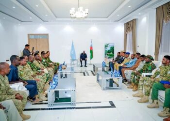 Aden Madobe seated before South West State military commanders at a security meeting in Baidoa