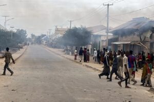 Smoke rises over a Baidoa street after clashes between federal troops and forces loyal to Laftagareen