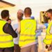 Electoral commission staff in marked vests unload polling materials from an aircraft ahead of the Hirshabelle vote on 20 August