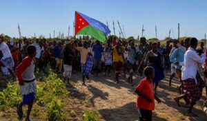 Supporters carry the Koonfur Bari flag at a mass gathering in Lower Shabelle, the administration now flying its flag over Marka