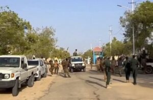 Puntland forces and technicals at the gate of the former PSF compound in Bosaso after the handover