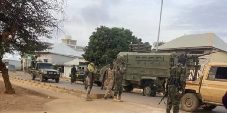 Somali National Army troops and armoured vehicles on a Baidoa street, the city at the centre of the new federal offensive in the Bay region