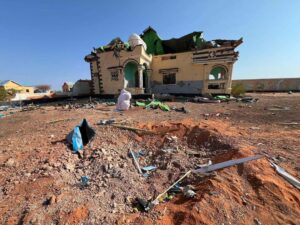The crater and the wrecked house at Doolow that Fahad Yasin says Speaker Abdulkadir Mohamed Nur ordered struck, still unexamined by any published inquiry