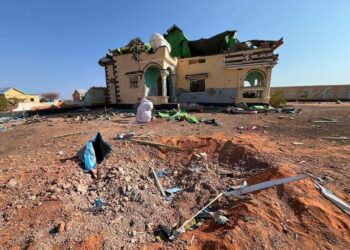 The crater and the wrecked house at Doolow that Fahad Yasin says Speaker Abdulkadir Mohamed Nur ordered struck, still unexamined by any published inquiry