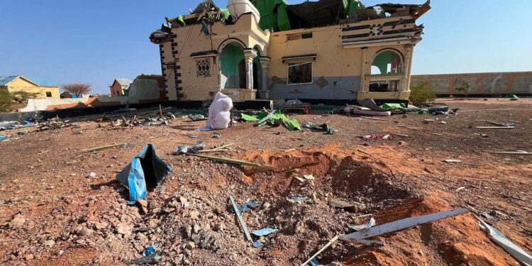 The crater and the wrecked house at Doolow that Fahad Yasin says Speaker Abdulkadir Mohamed Nur ordered struck, still unexamined by any published inquiry
