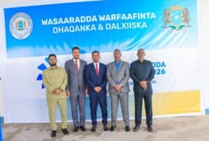 Officials before the Ministry of Information banner at the strategic communication forum in Mogadishu
