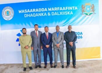 Officials before the Ministry of Information banner at the strategic communication forum in Mogadishu