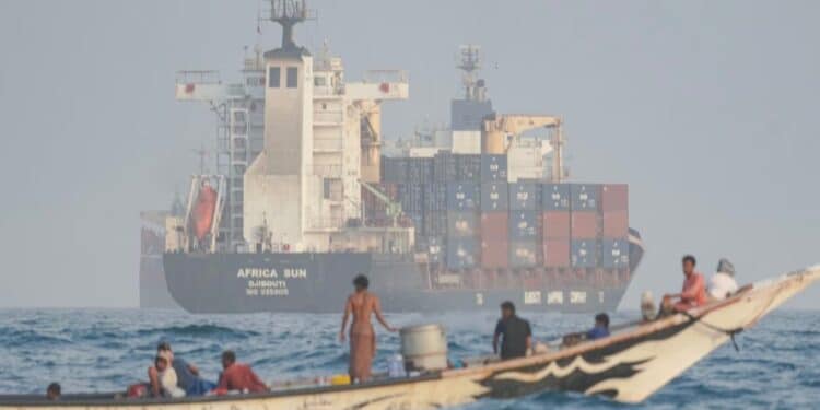 A skiff alongside a cargo ship in the Gulf of Aden, the crossing used to move weapons from the Houthis to al-Shabaab