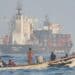 A skiff alongside a cargo ship in the Gulf of Aden, the crossing used to move weapons from the Houthis to al-Shabaab