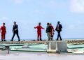 President Hassan Sheikh Mohamud crosses the helideck of the Turkish drillship Cagri Bey at the CURAD-1 well off Mogadishu, October 2026
