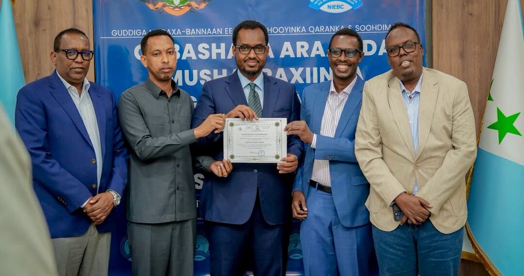 Liibaan Ahmed Hassan's candidacy certificate is presented at an electoral commission ceremony ahead of the Galmudug presidential vote