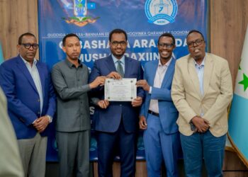 Liibaan Ahmed Hassan's candidacy certificate is presented at an electoral commission ceremony ahead of the Galmudug presidential vote