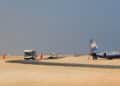 A passenger shuttle and aircraft on the apron at Bosaso airport, the Puntland airfield from which Emirati drones flew to strike al-Shabaab in Galgala
