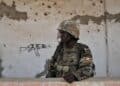 A Ugandan soldier of the African Union force on guard in Somalia, as Muhoozi Kainerugaba announces the start of the UPDF withdrawal