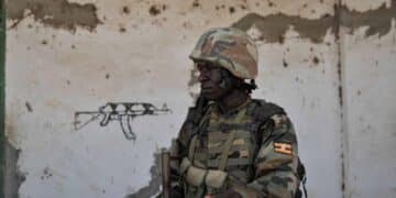 A Ugandan soldier of the African Union force on guard in Somalia, as Muhoozi Kainerugaba announces the start of the UPDF withdrawal